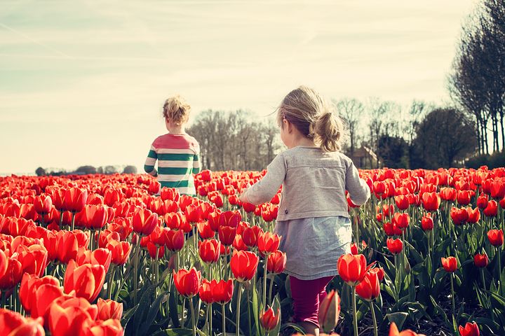 Joyful Moments Among Vibrant Flowers