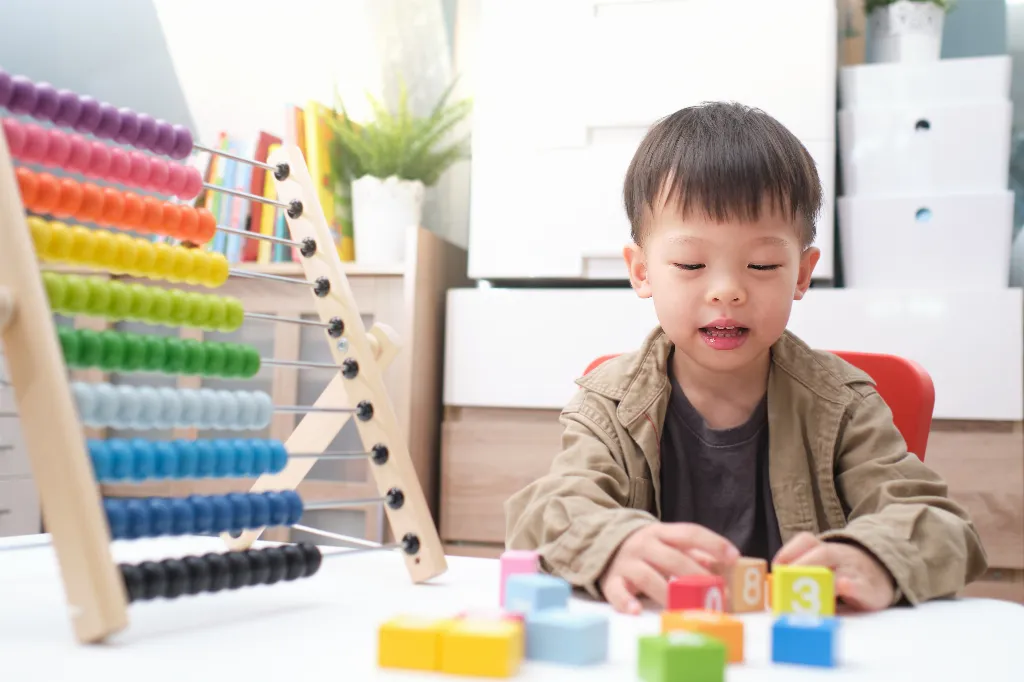 Young Child Engaged in Learning Activities